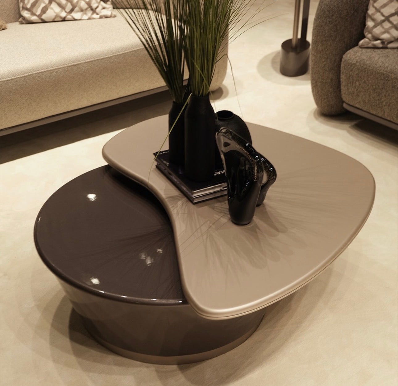 Regal luxury furniture collection featuring curved sofa seating, modern dining table with upholstered chairs, and contemporary living room design.