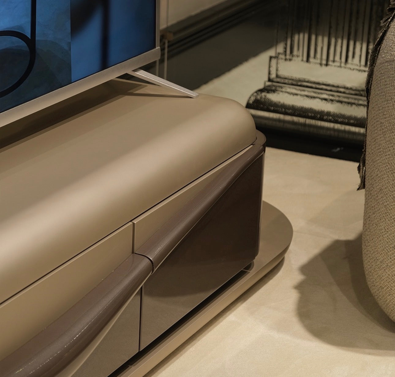 Regal luxury furniture collection featuring curved sofa seating, modern dining table with upholstered chairs, and contemporary living room design.