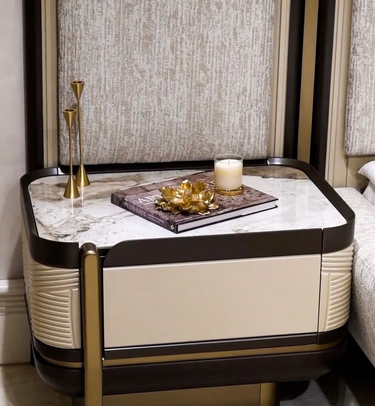 Cinder luxury bedroom collection featuring upholstered bed, modern vanity, neutral nightstands, and contemporary wardrobe system.