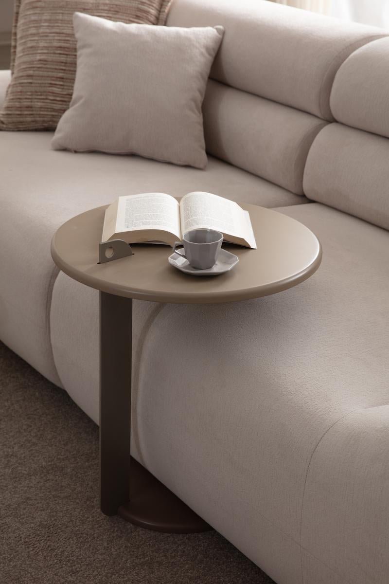 Valour modern luxury living room furniture collection featuring sculptural curved sofas, neutral upholstery, and minimalist contemporary design.