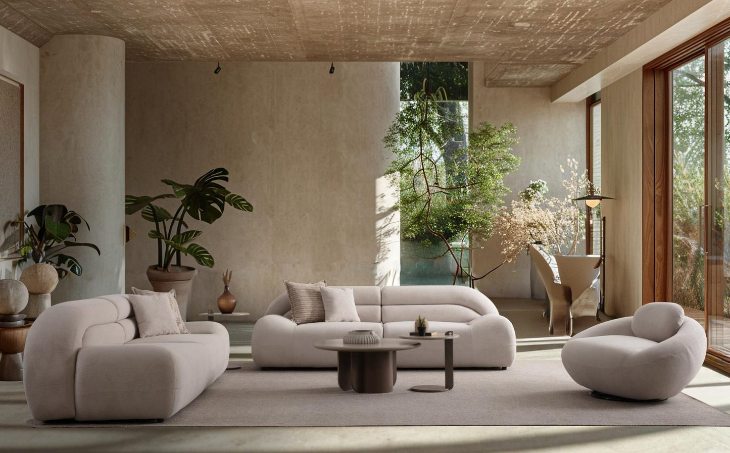 Valour modern luxury living room furniture collection featuring sculptural curved sofas, neutral upholstery, and minimalist contemporary design.