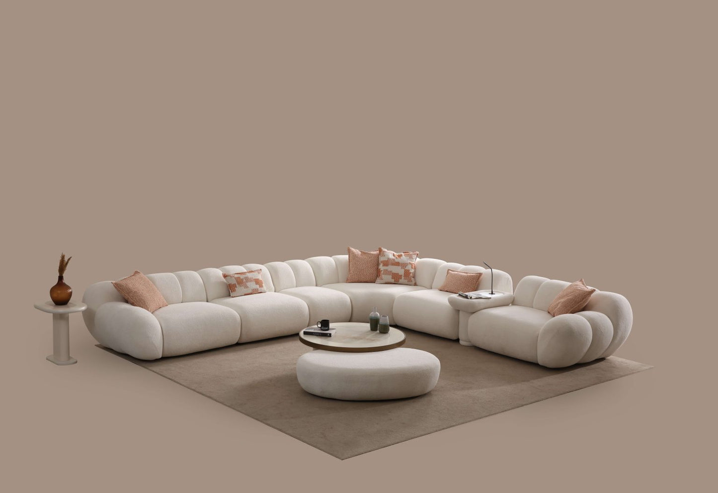 Lunar sculptural living room collection featuring curved modular sofa, rounded lounge chair, and modern minimalist interior design.