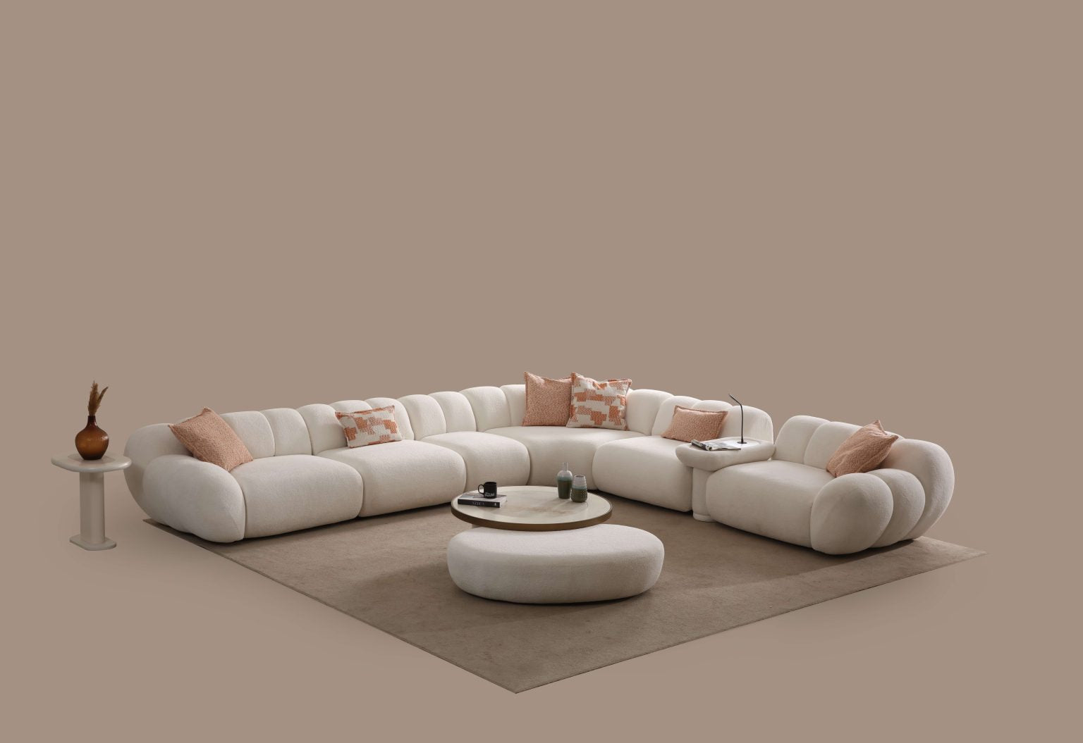 Lunar sculptural living room collection featuring curved modular sofa, rounded lounge chair, and modern minimalist interior design.