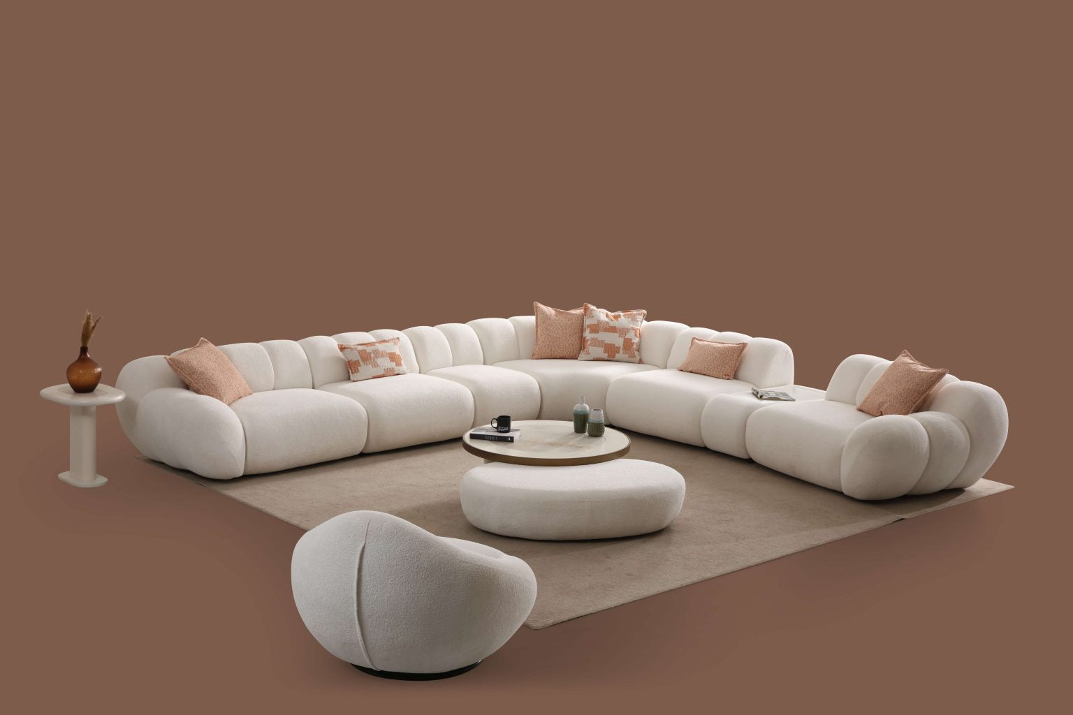 Lunar sculptural living room collection featuring curved modular sofa, rounded lounge chair, and modern minimalist interior design.