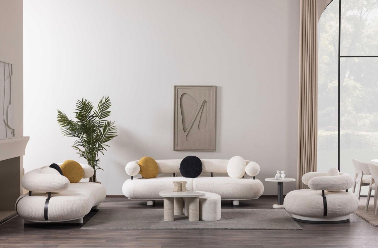 Amberhall modern curved furniture collection featuring sculptural sofa seating, ivory textures, and contemporary minimalist interior design.
