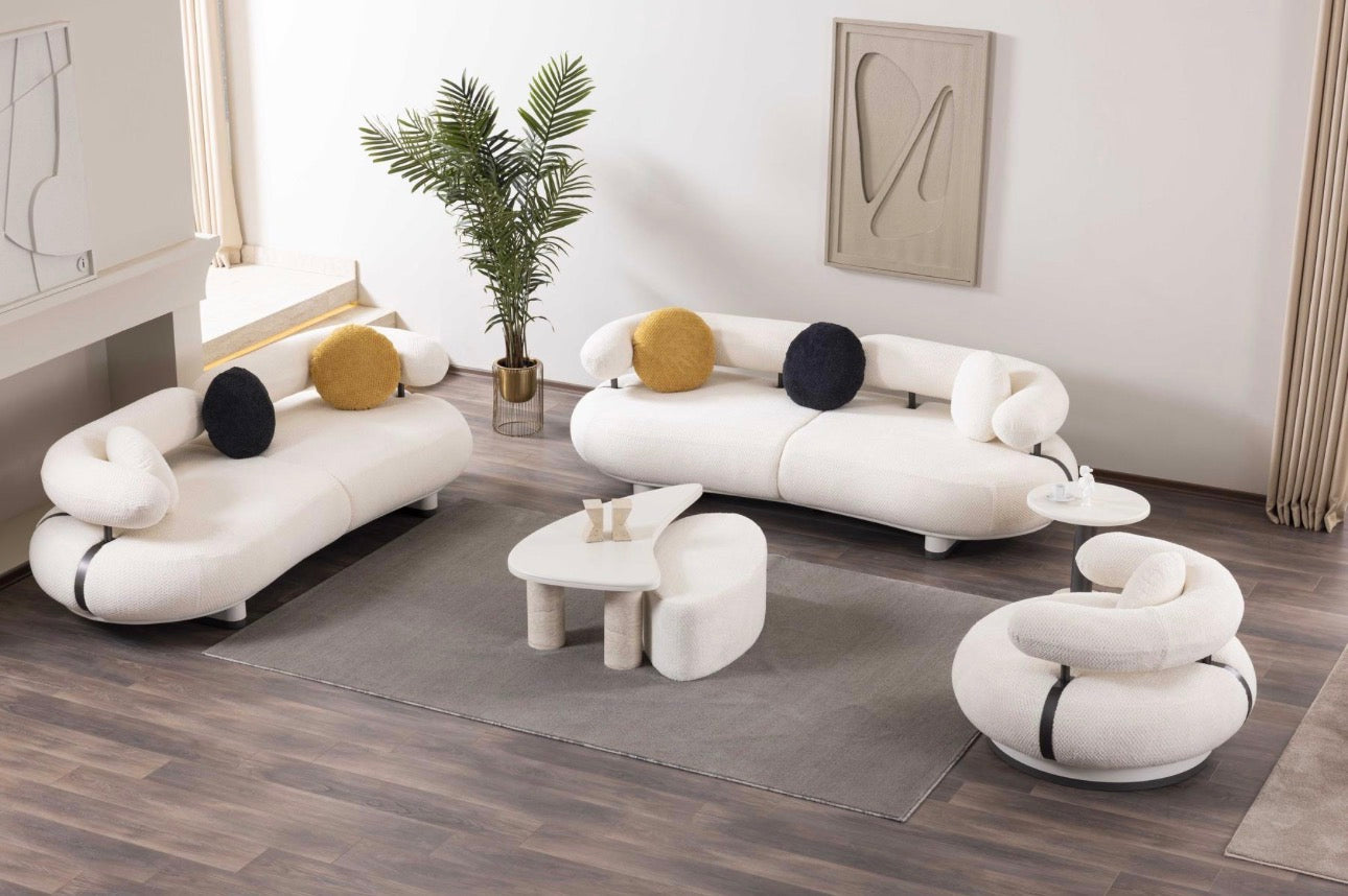 Amberhall modern curved furniture collection featuring sculptural sofa seating, ivory textures, and contemporary minimalist interior design.