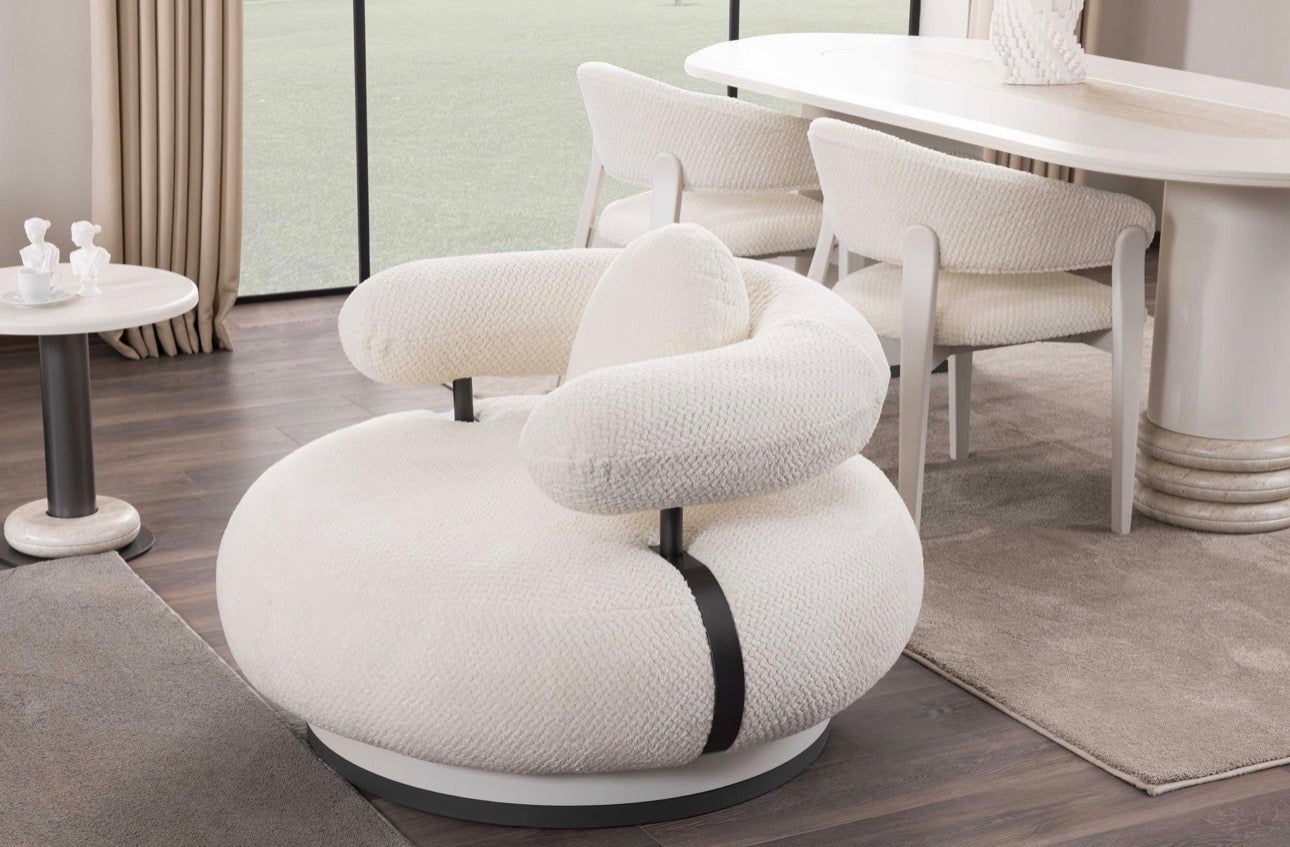 Amberhall modern curved furniture collection featuring sculptural sofa seating, ivory textures, and contemporary minimalist interior design.