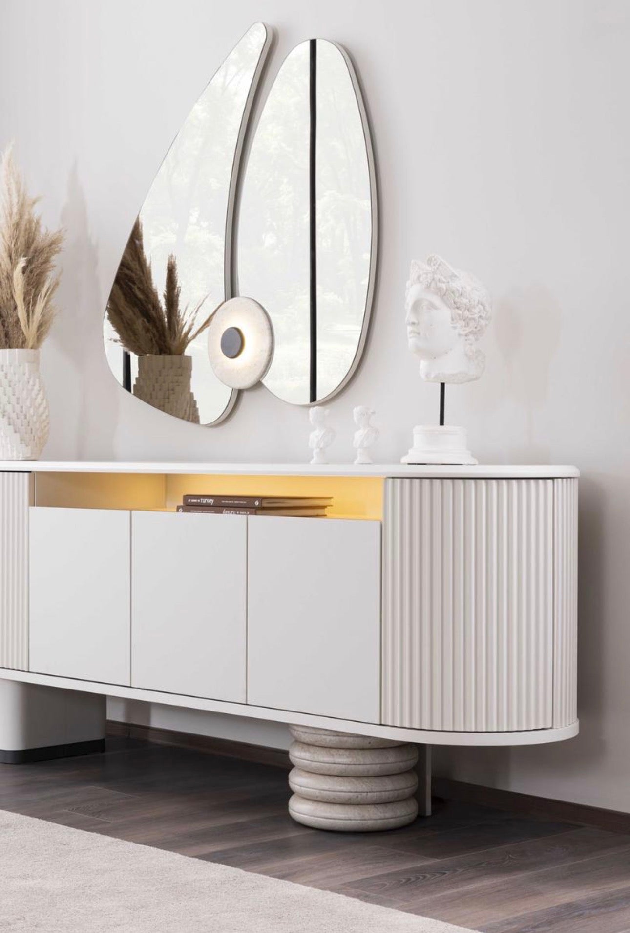 Amberhall modern curved furniture collection featuring sculptural sofa seating, ivory textures, and contemporary minimalist interior design.