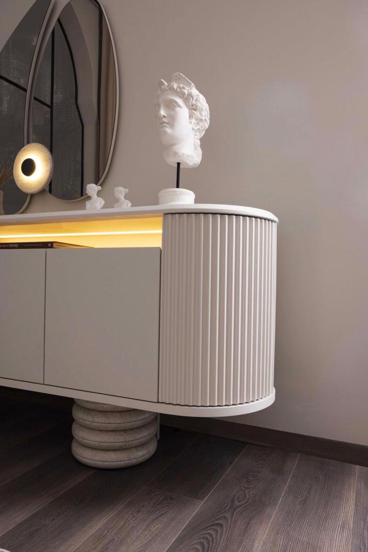 Amberhall modern curved furniture collection featuring sculptural sofa seating, ivory textures, and contemporary minimalist interior design.