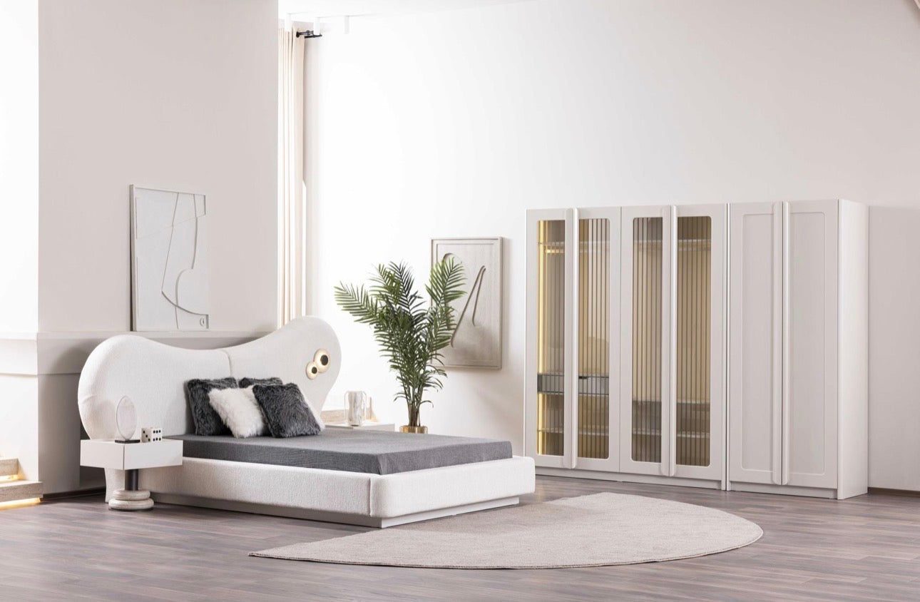 Amberhall modern curved furniture collection featuring sculptural sofa seating, ivory textures, and contemporary minimalist interior design.