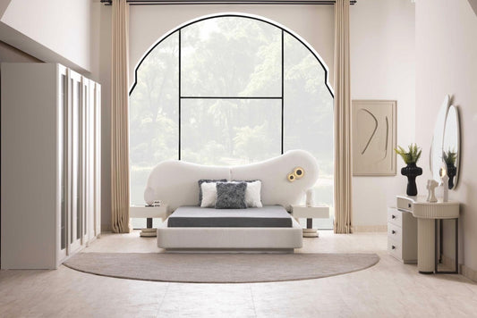 Amberhall modern curved furniture collection featuring sculptural sofa seating, ivory textures, and contemporary minimalist interior design.