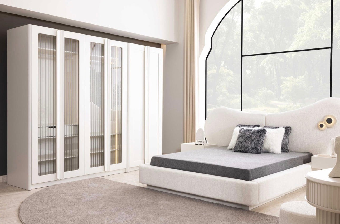 Amberhall modern curved furniture collection featuring sculptural sofa seating, ivory textures, and contemporary minimalist interior design.