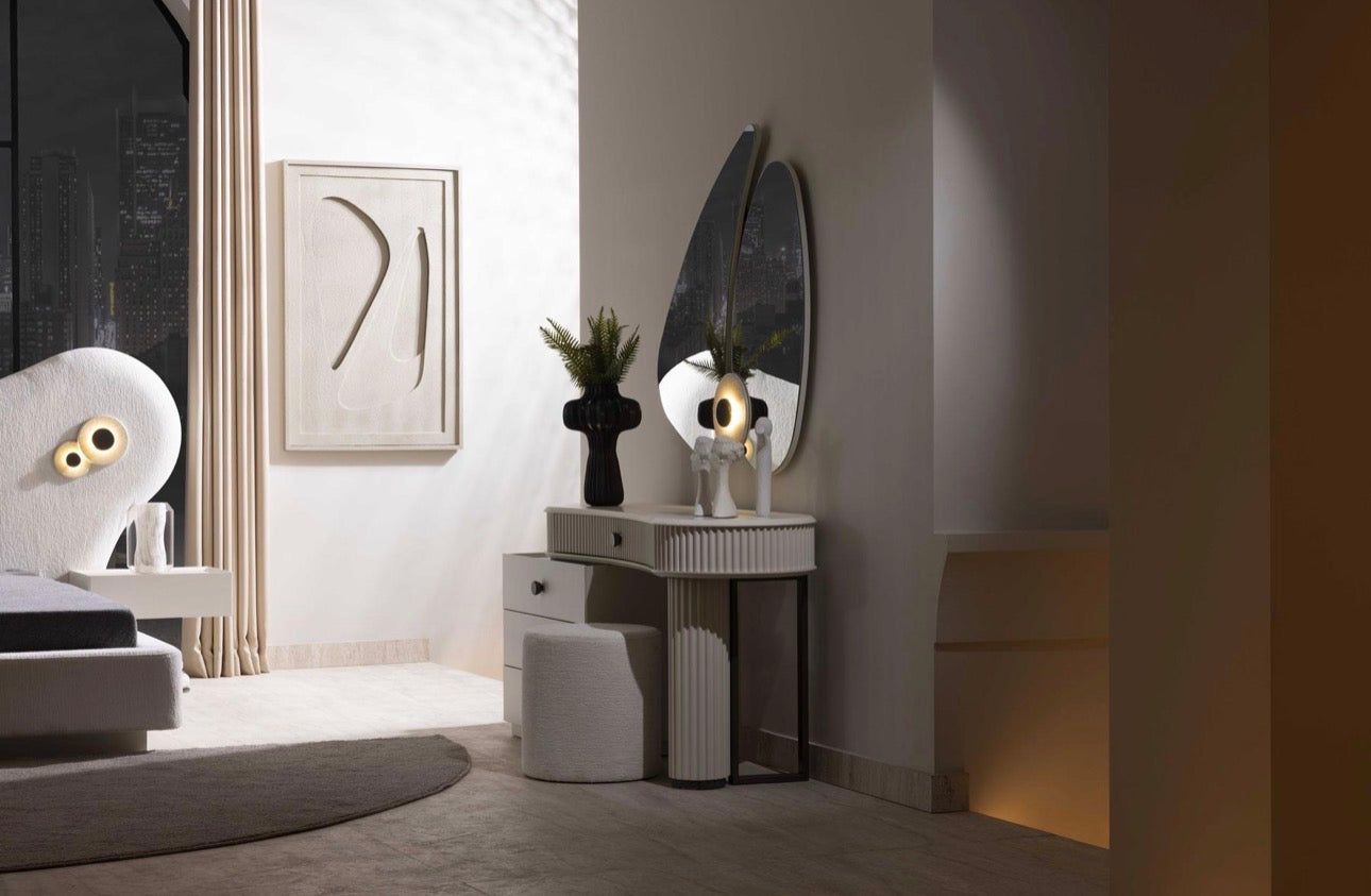 Amberhall modern curved furniture collection featuring sculptural sofa seating, ivory textures, and contemporary minimalist interior design.