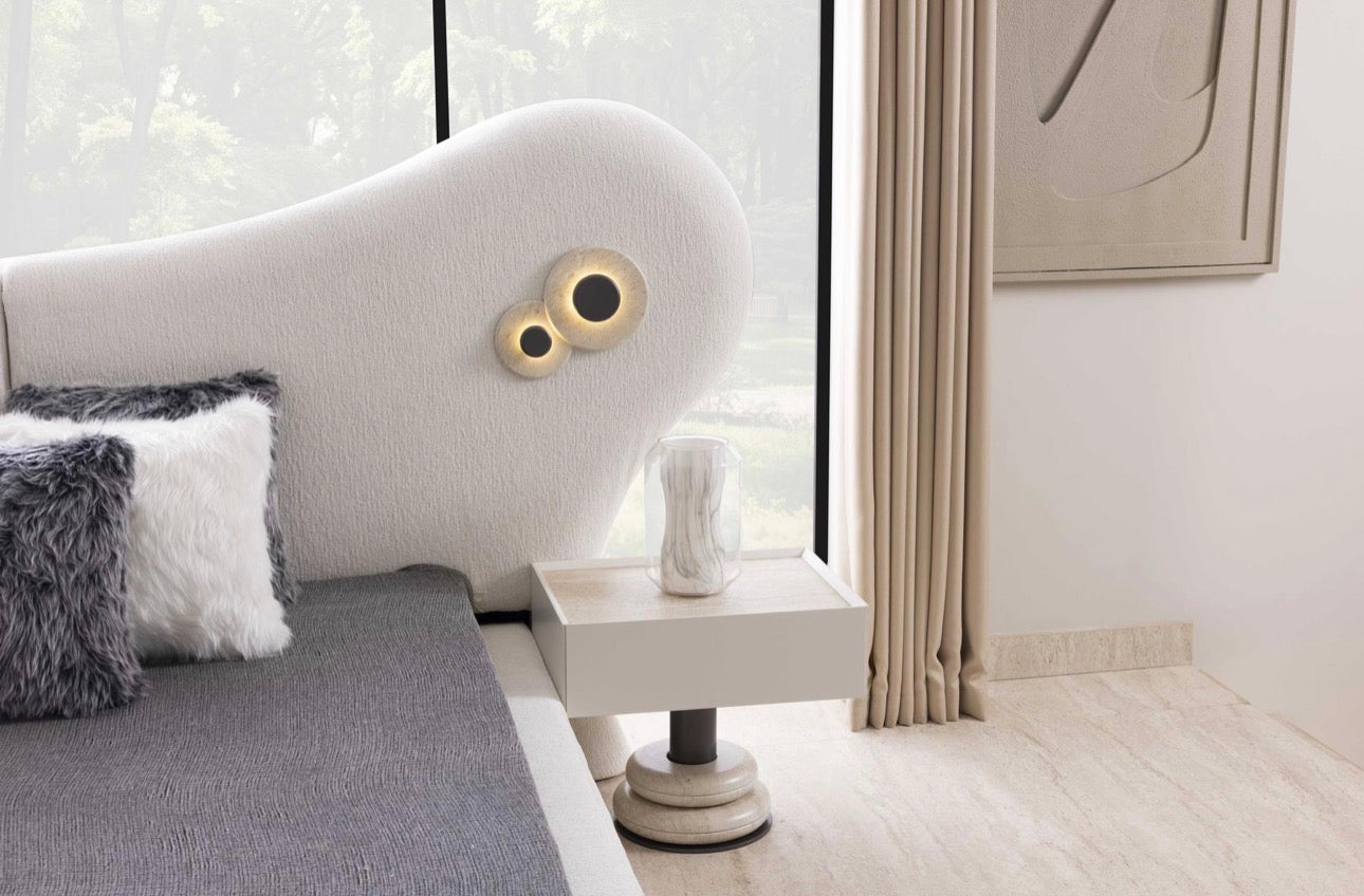 Amberhall modern curved furniture collection featuring sculptural sofa seating, ivory textures, and contemporary minimalist interior design.