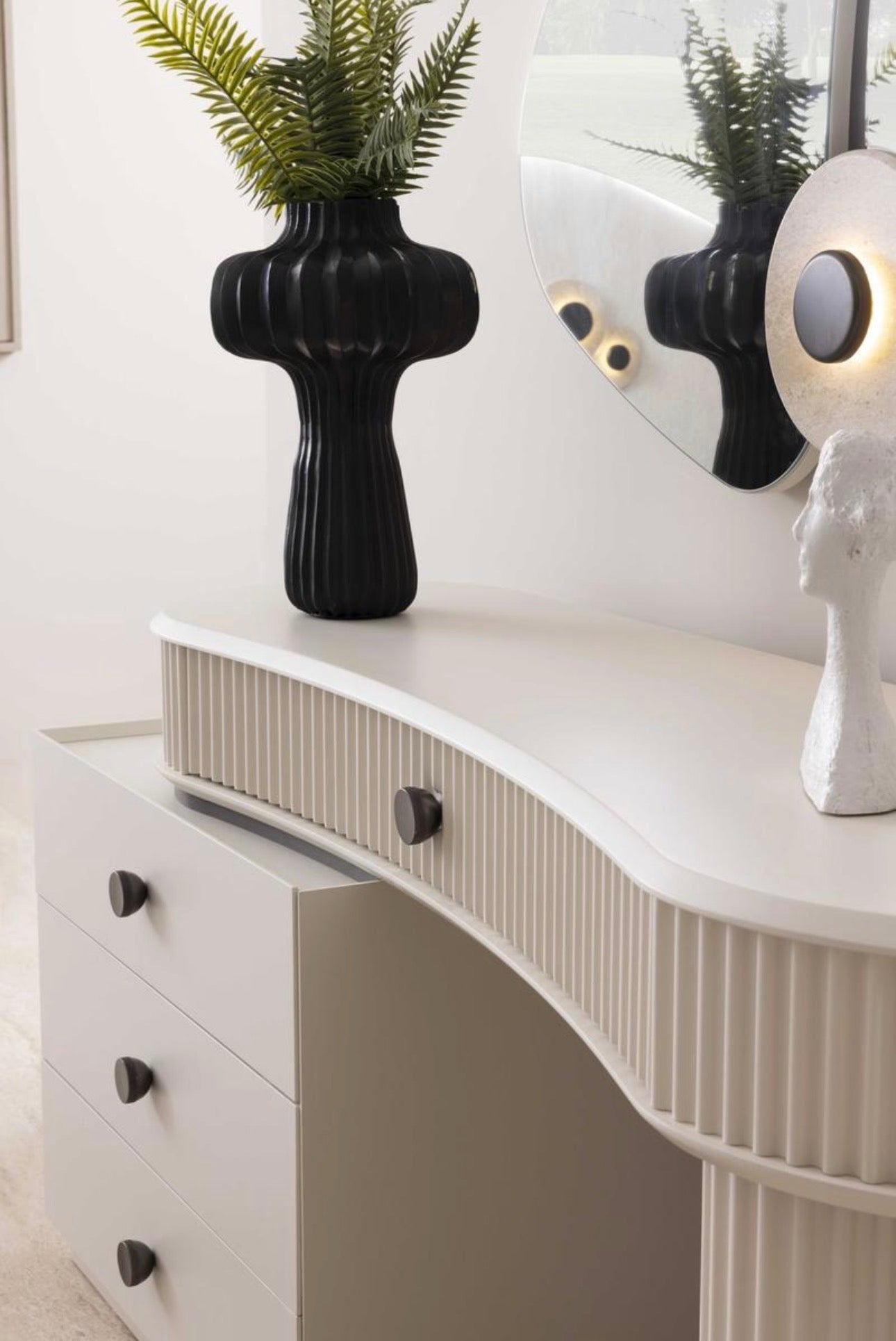 Amberhall modern curved furniture collection featuring sculptural sofa seating, ivory textures, and contemporary minimalist interior design.