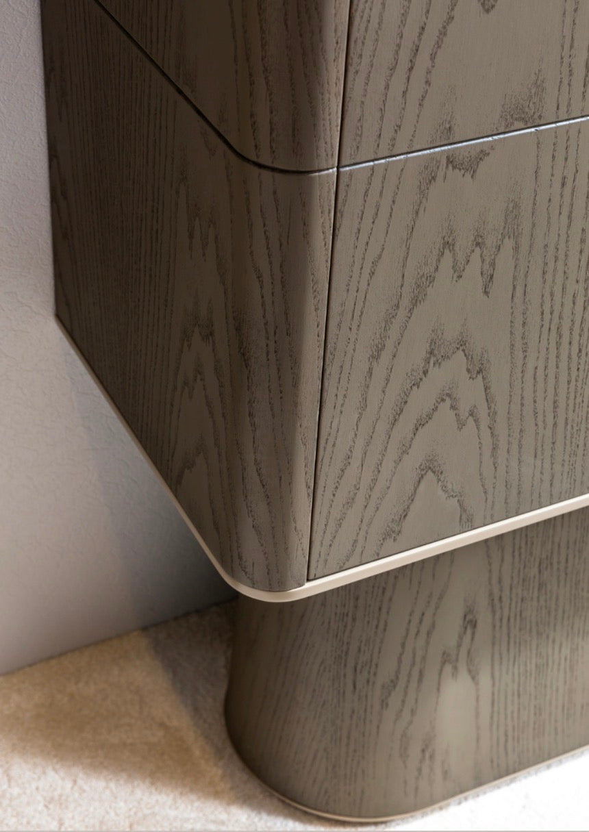 Stoneveil luxury furniture collection featuring modular sofa seating, modern dining table, sculptural accent chairs, luxury bedroom design, and illuminated walk in wardrobe.