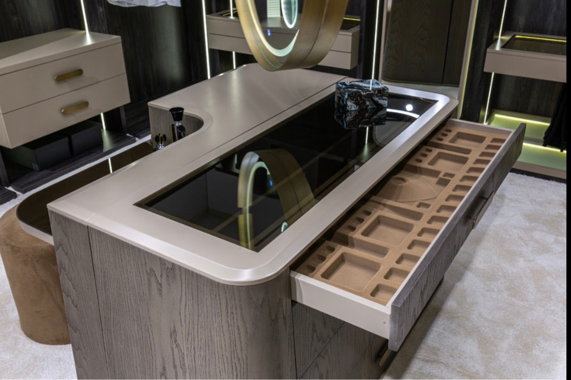 Stoneveil luxury furniture collection featuring modular sofa seating, modern dining table, sculptural accent chairs, luxury bedroom design, and illuminated walk in wardrobe.