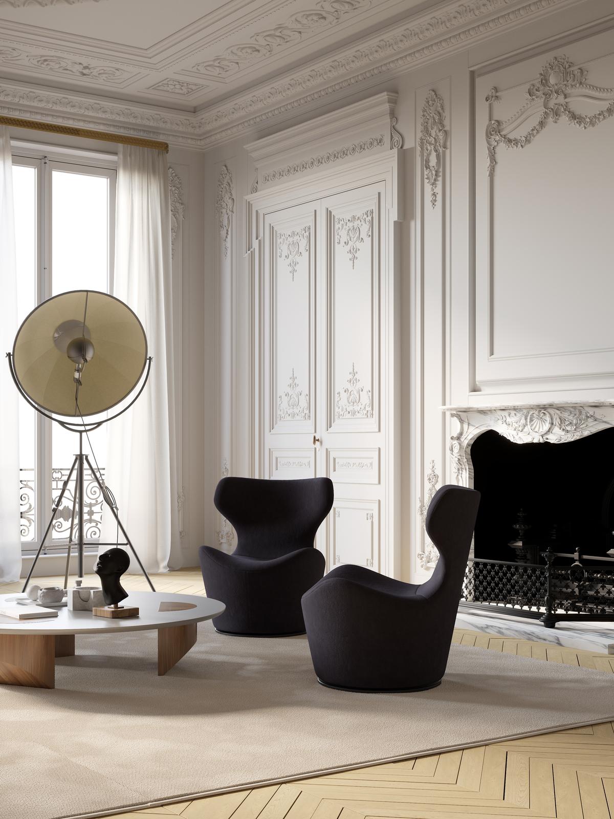 Overtime luxury furniture collection featuring curved sofa, sculptural lounge chairs, modern coffee table, and classic architectural interior setting.