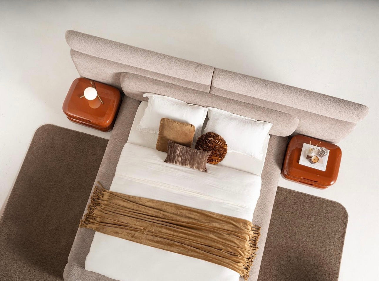 Urbane modern luxury furniture collection featuring sculptural dining table, curved bedroom furniture, and terracotta lacquer accents.