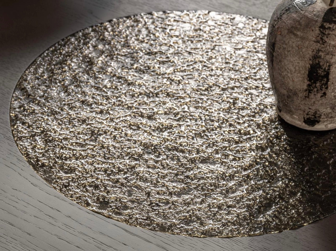 Urbane modern luxury furniture collection featuring sculptural dining table, curved bedroom furniture, and terracotta lacquer accents.