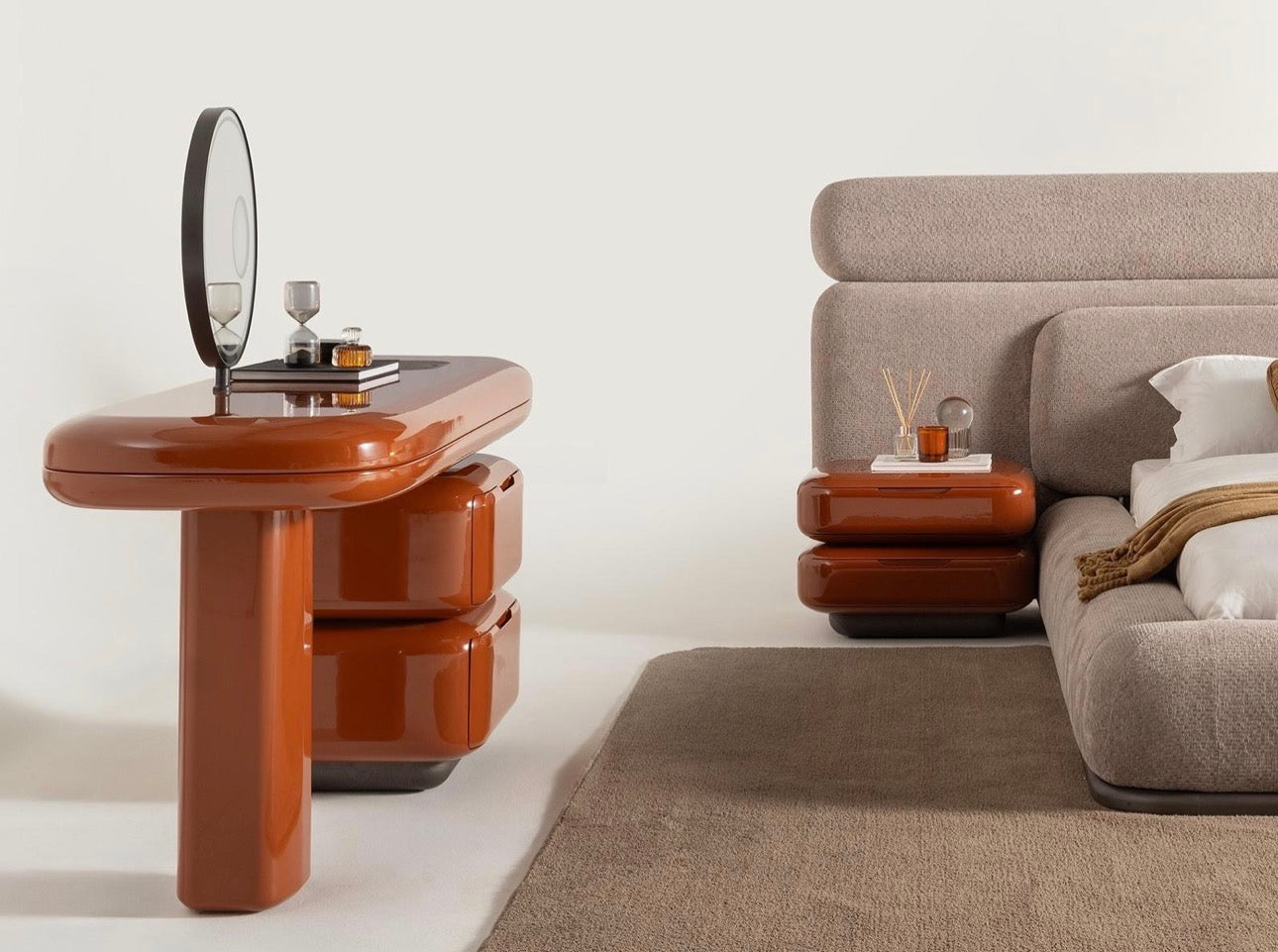 Urbane modern luxury furniture collection featuring sculptural dining table, curved bedroom furniture, and terracotta lacquer accents.