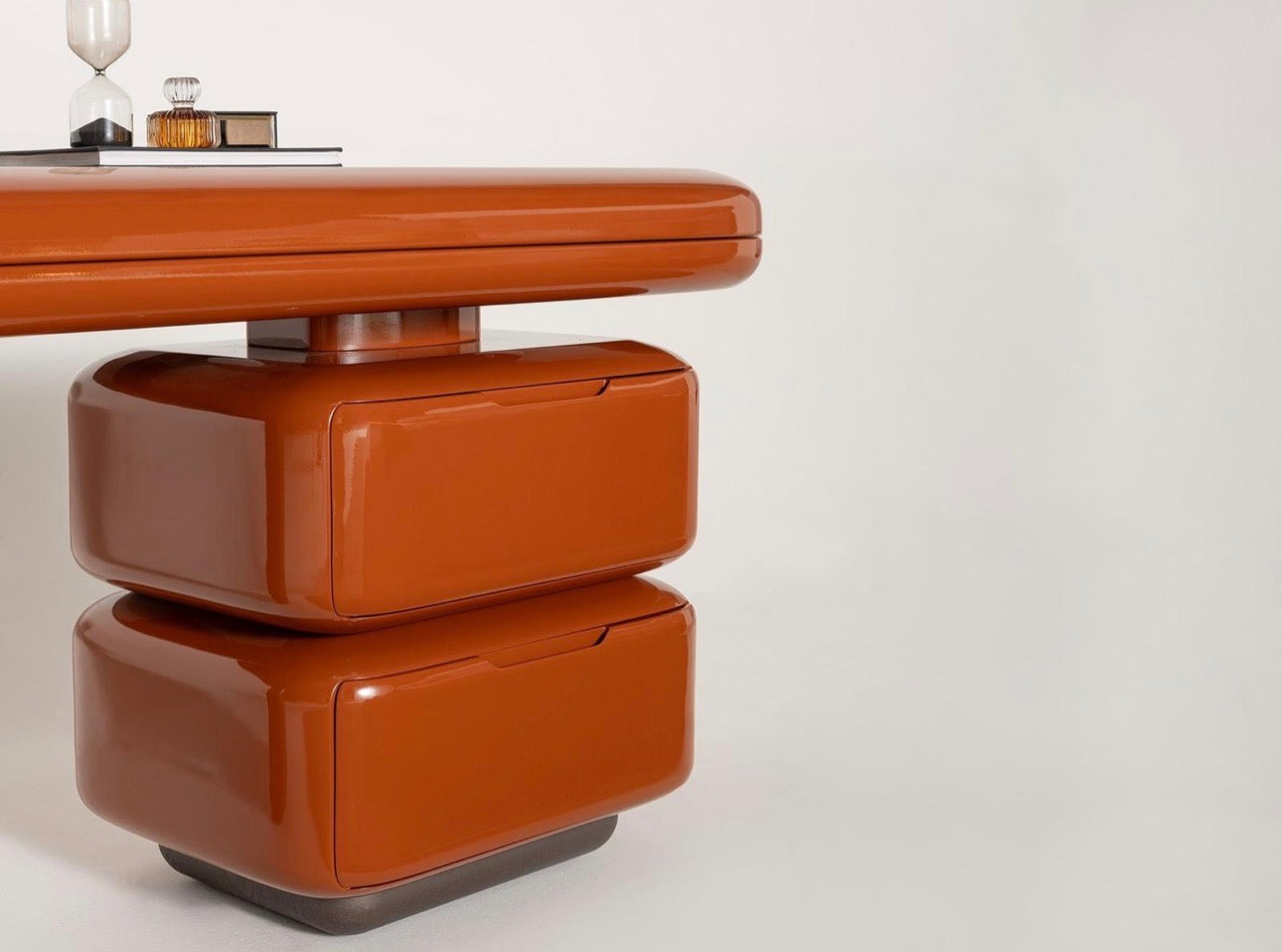 Urbane modern luxury furniture collection featuring sculptural dining table, curved bedroom furniture, and terracotta lacquer accents.