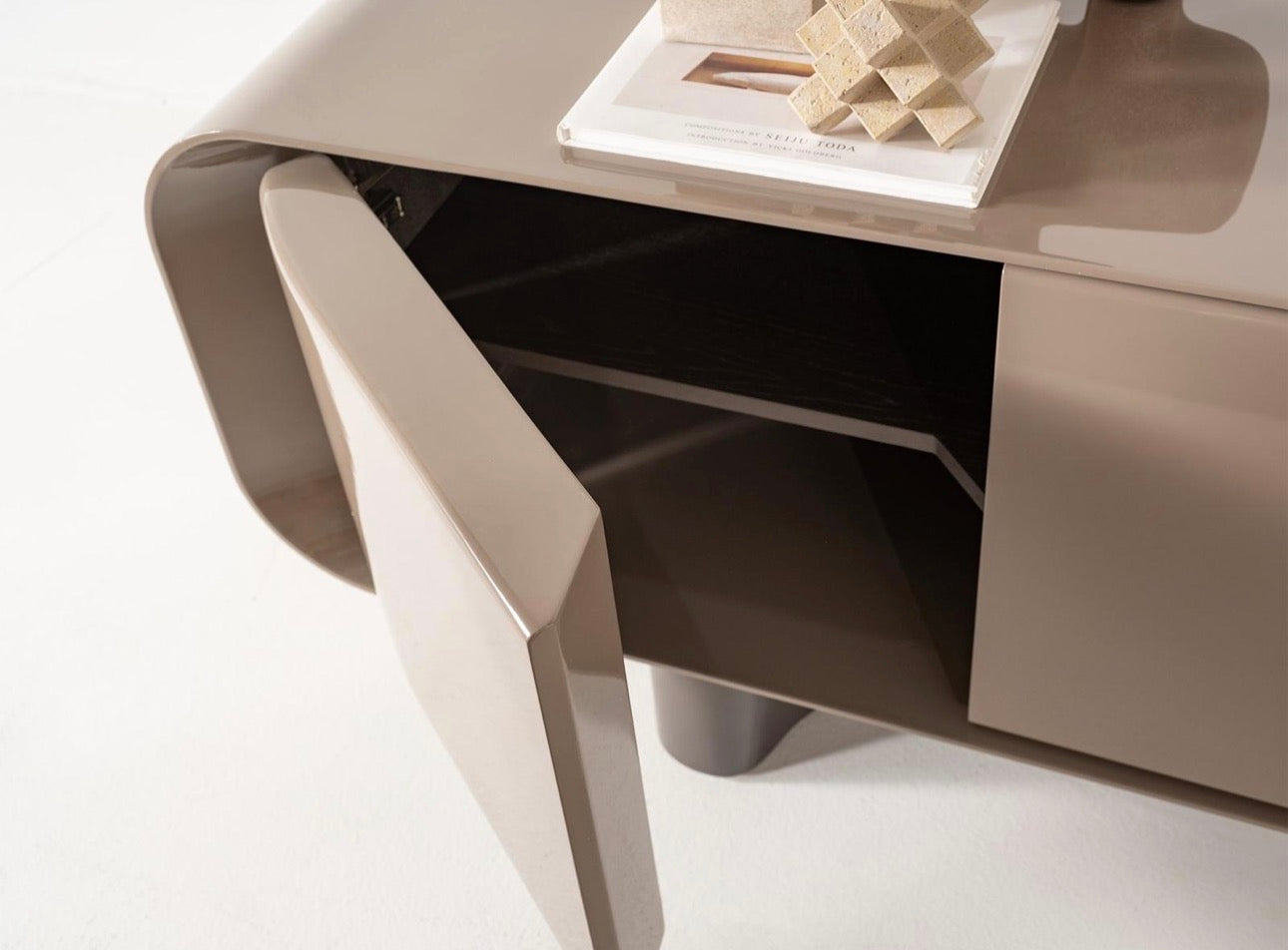 Urbane modern luxury furniture collection featuring sculptural dining table, curved bedroom furniture, and terracotta lacquer accents.