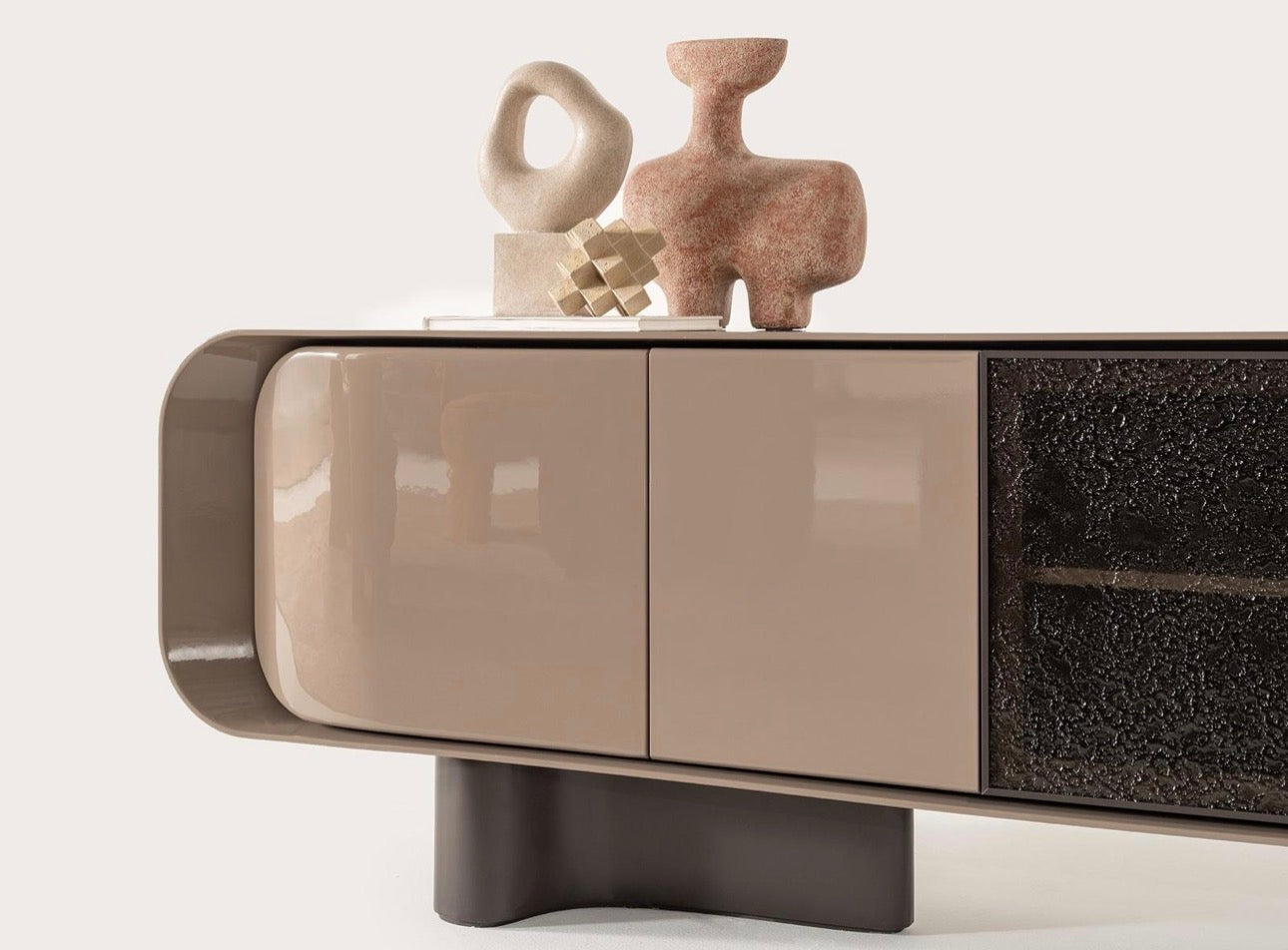 Urbane modern luxury furniture collection featuring sculptural dining table, curved bedroom furniture, and terracotta lacquer accents.