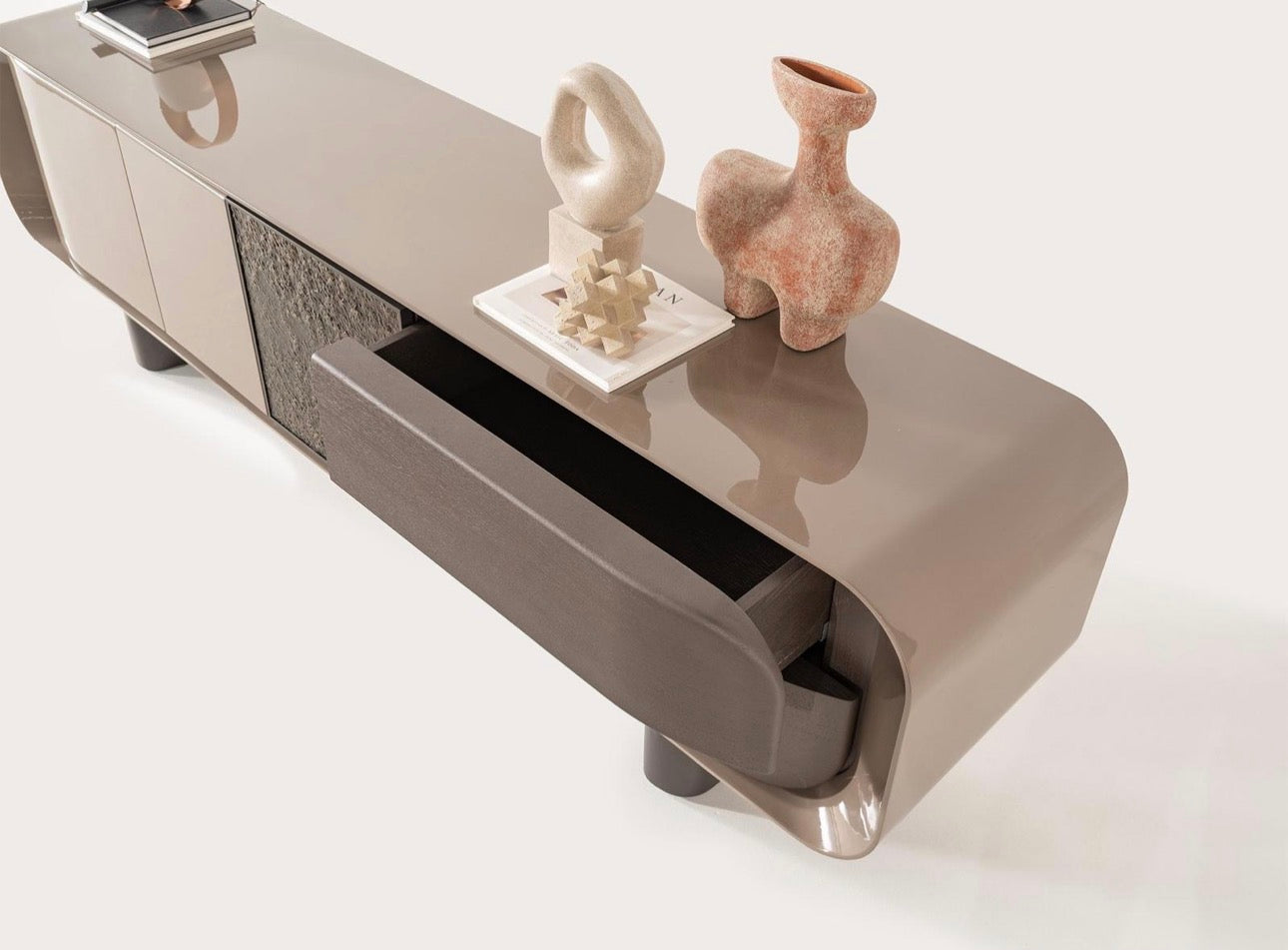 Urbane modern luxury furniture collection featuring sculptural dining table, curved bedroom furniture, and terracotta lacquer accents.