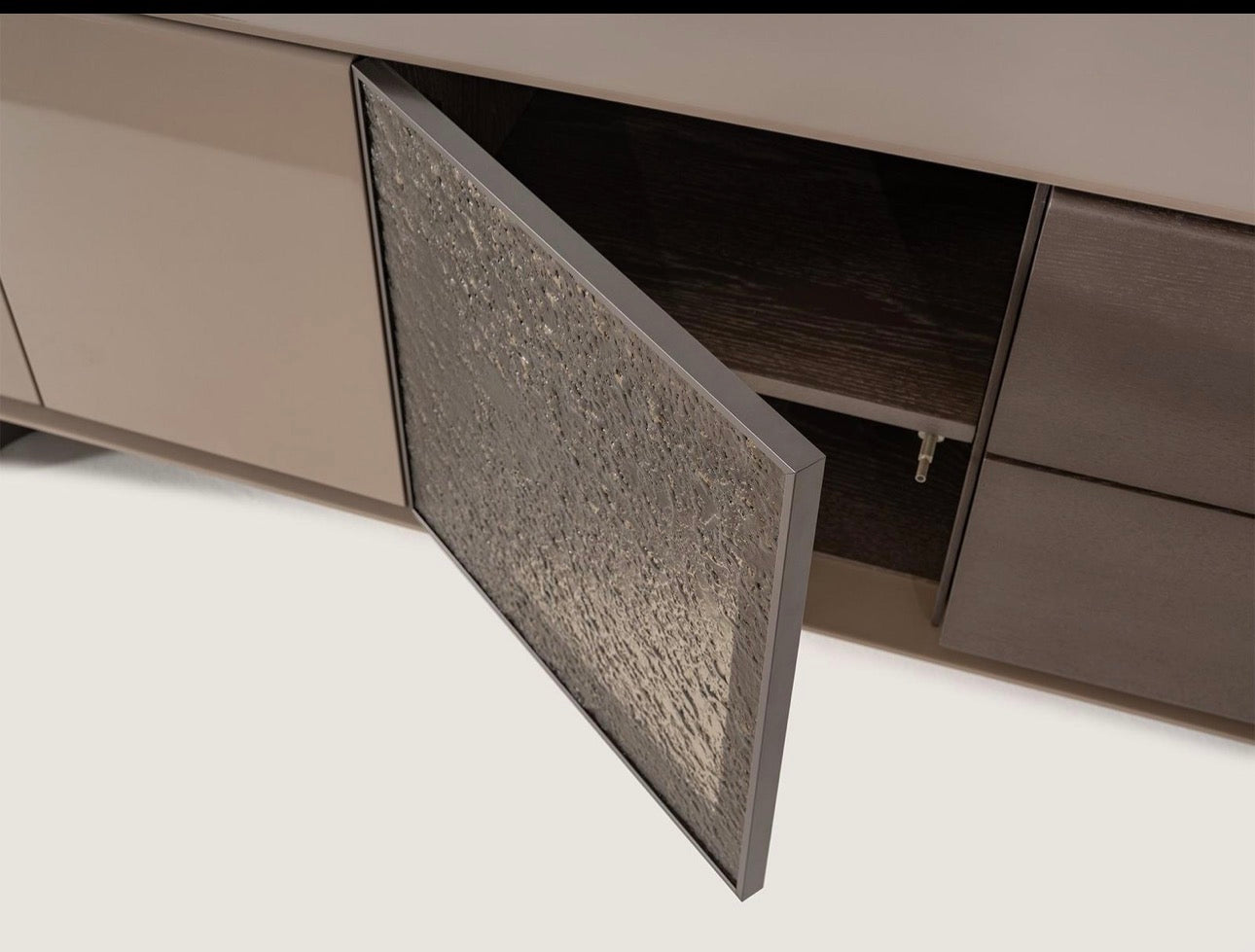 Urbane modern luxury furniture collection featuring sculptural dining table, curved bedroom furniture, and terracotta lacquer accents.