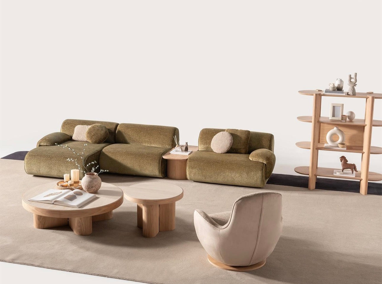 Lumen modern organic living room collection with curved sectional sofa, natural wood coffee tables, and warm minimalist interior design.