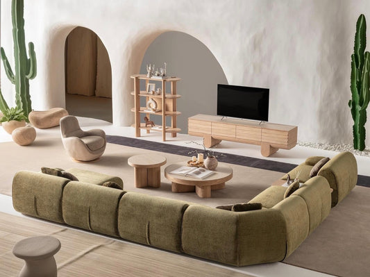 Lumen modern organic living room collection with curved sectional sofa, natural wood coffee tables, and warm minimalist interior design.