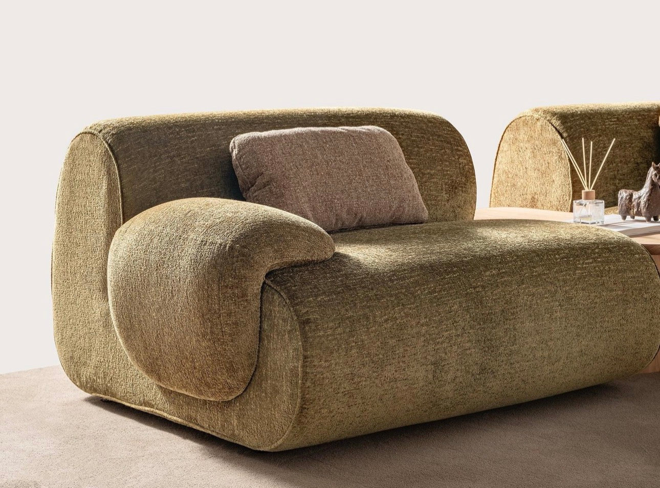 Lumen modern organic living room collection with curved sectional sofa, natural wood coffee tables, and warm minimalist interior design.