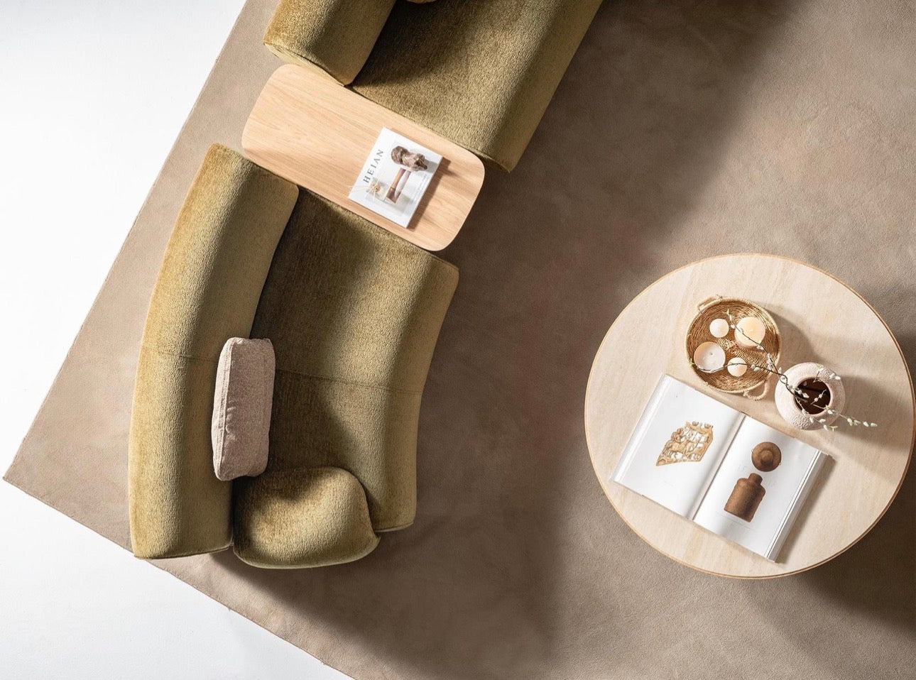 Lumen modern organic living room collection with curved sectional sofa, natural wood coffee tables, and warm minimalist interior design.