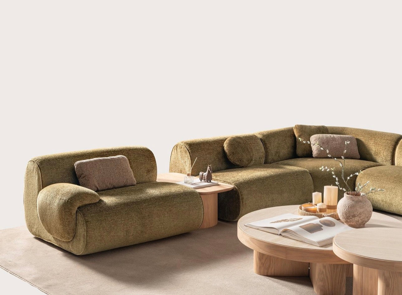 Lumen modern organic living room collection with curved sectional sofa, natural wood coffee tables, and warm minimalist interior design.