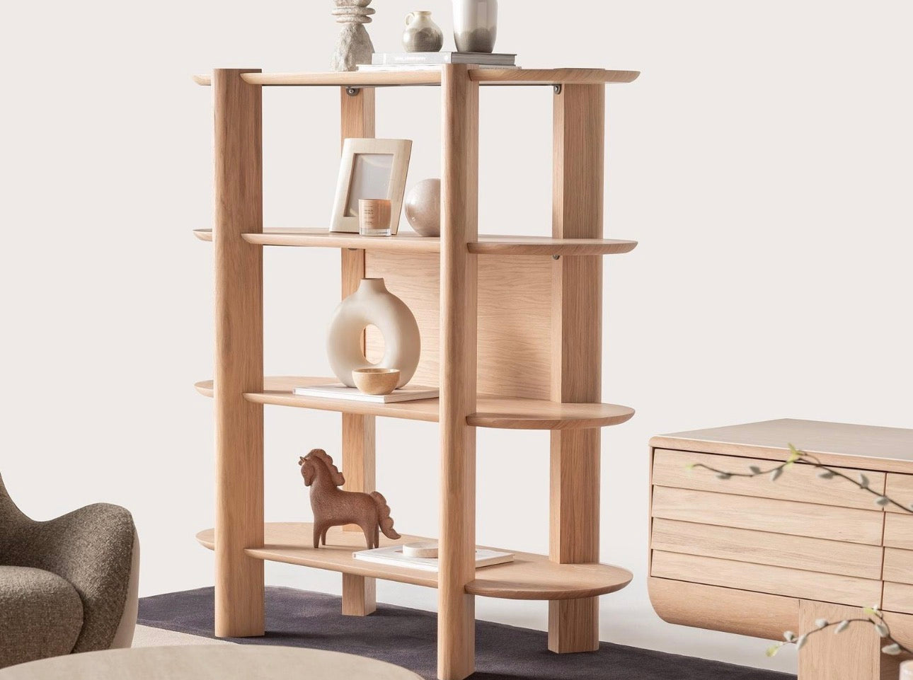 Lumen modern organic living room collection with curved sectional sofa, natural wood coffee tables, and warm minimalist interior design.