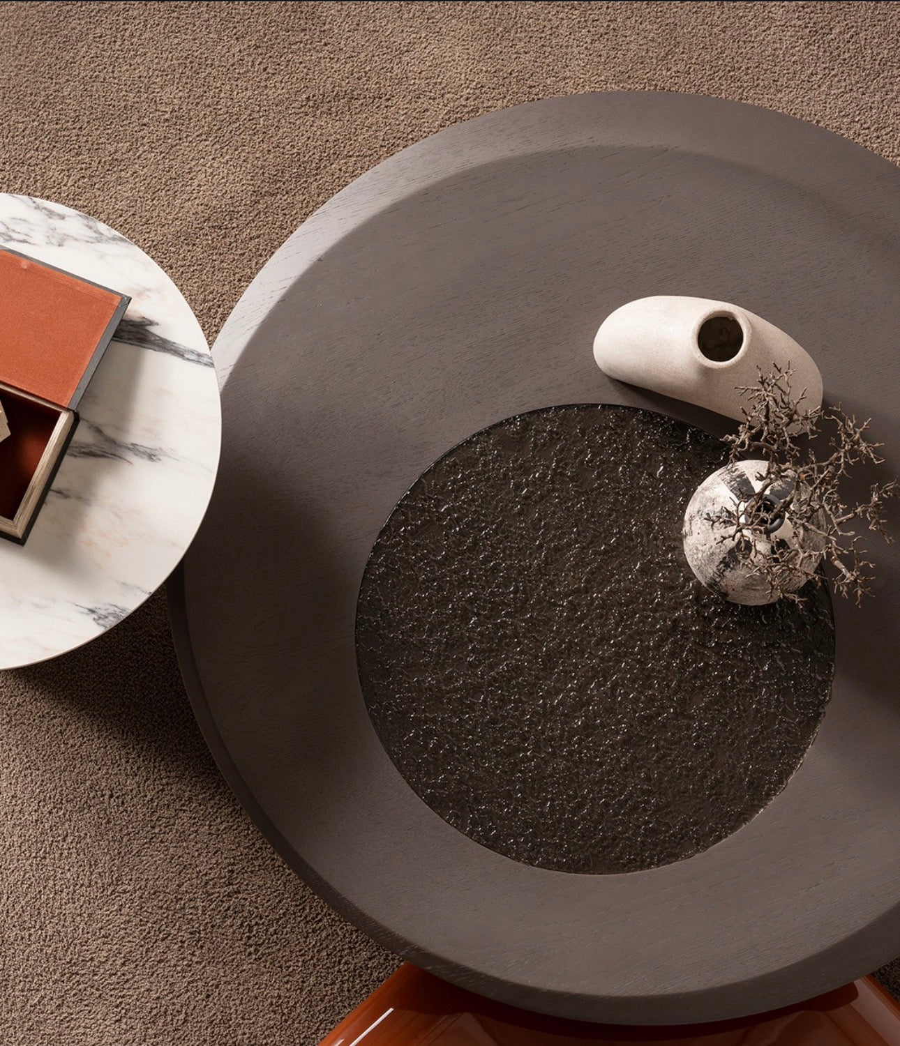 Urbane modern luxury furniture collection featuring sculptural dining table, curved bedroom furniture, and terracotta lacquer accents.