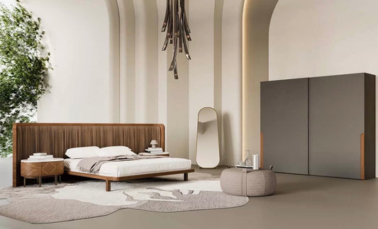 Evening luxury bedroom collection featuring sculptural wood bed, modern nightstands, minimalist wardrobe, and contemporary bedroom design.