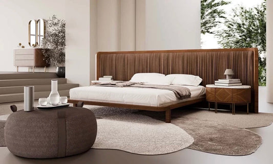Evening luxury bedroom collection featuring sculptural wood bed, modern nightstands, minimalist wardrobe, and contemporary bedroom design.