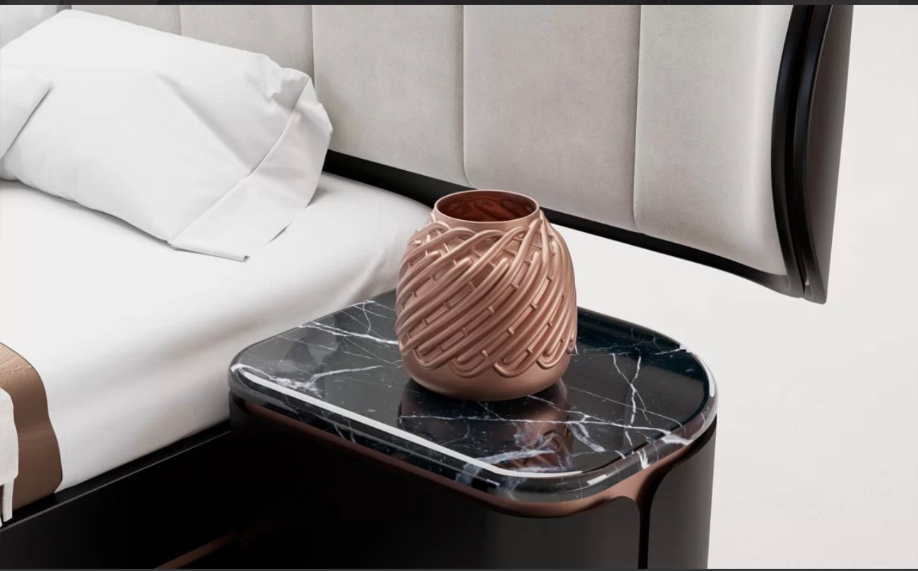 Petale luxury bedroom furniture collection with curved upholstered bed, sculptural nightstands, and dark lacquer wardrobe with rose-gold accents.