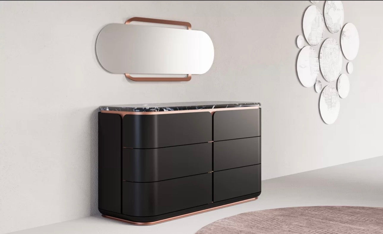 Petale luxury bedroom furniture collection with curved upholstered bed, sculptural nightstands, and dark lacquer wardrobe with rose-gold accents.