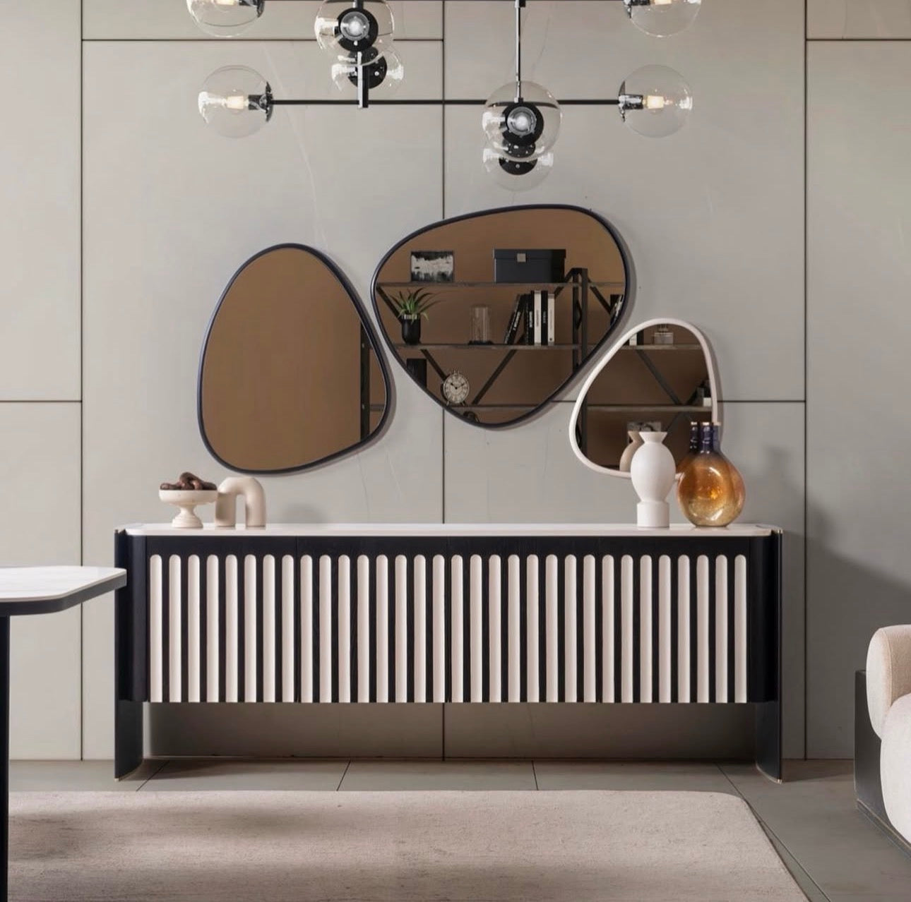 Reverie luxury furniture collection featuring sculptural sofa seating, zebra patterned accent chairs, modern dining table, and contemporary living room design.