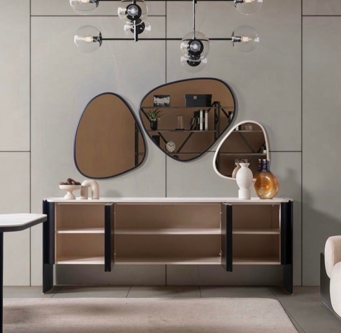 Reverie luxury furniture collection featuring sculptural sofa seating, zebra patterned accent chairs, modern dining table, and contemporary living room design.