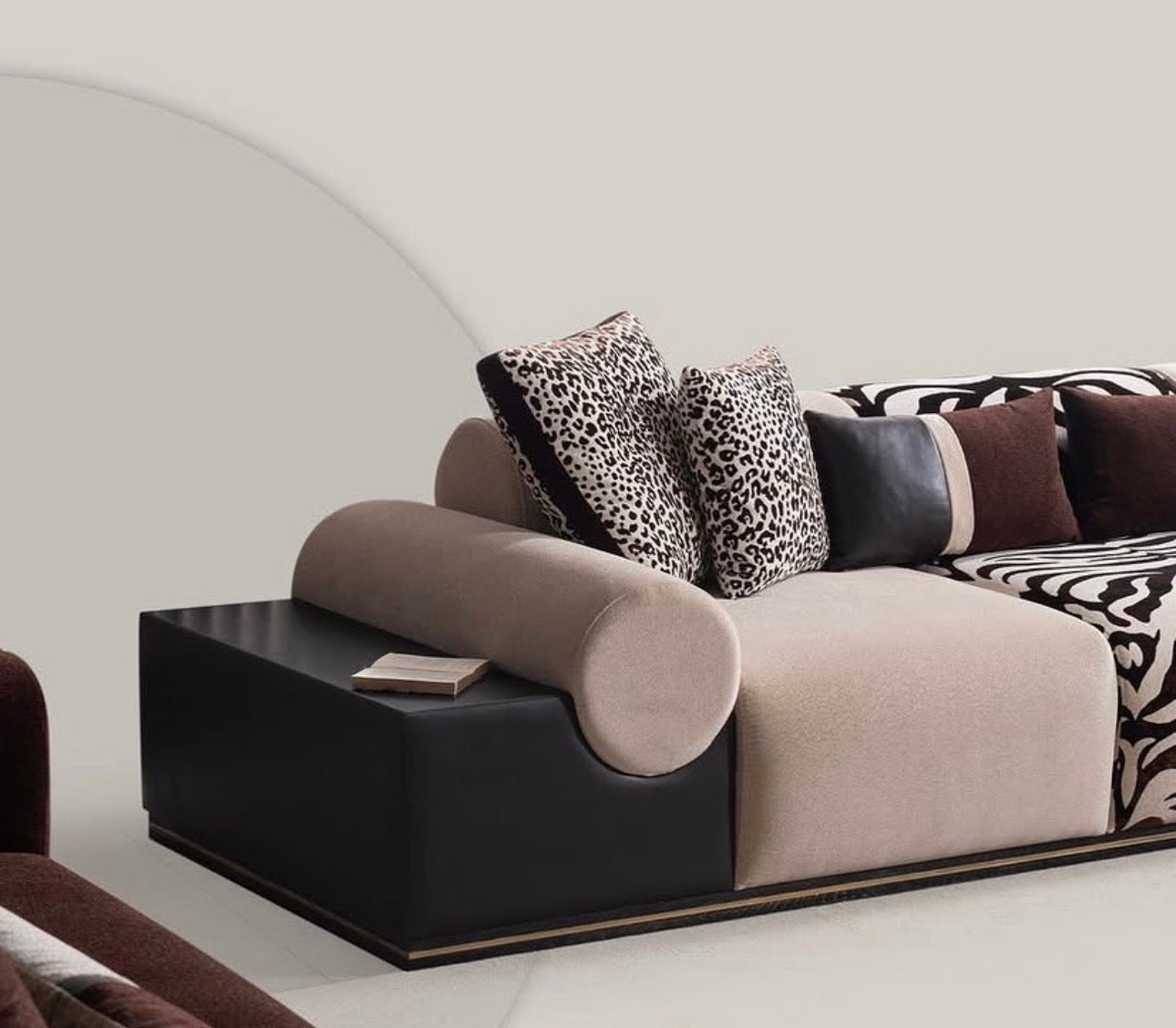 Reverie luxury furniture collection featuring sculptural sofa seating, zebra patterned accent chairs, modern dining table, and contemporary living room design.