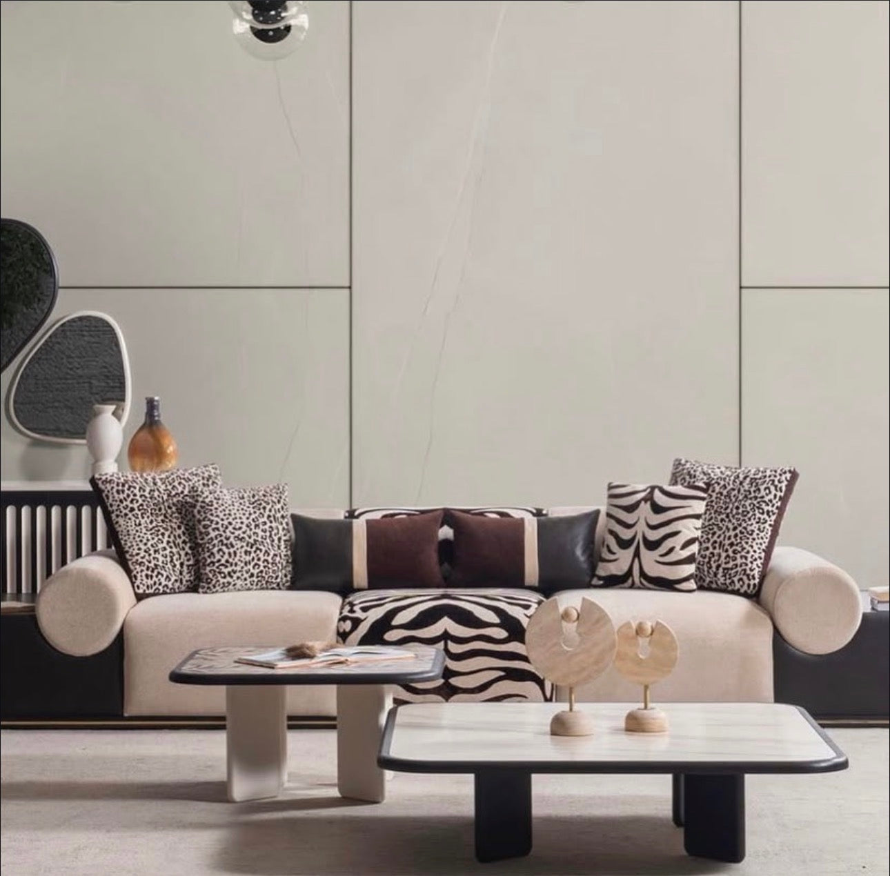 Reverie luxury furniture collection featuring sculptural sofa seating, zebra patterned accent chairs, modern dining table, and contemporary living room design.