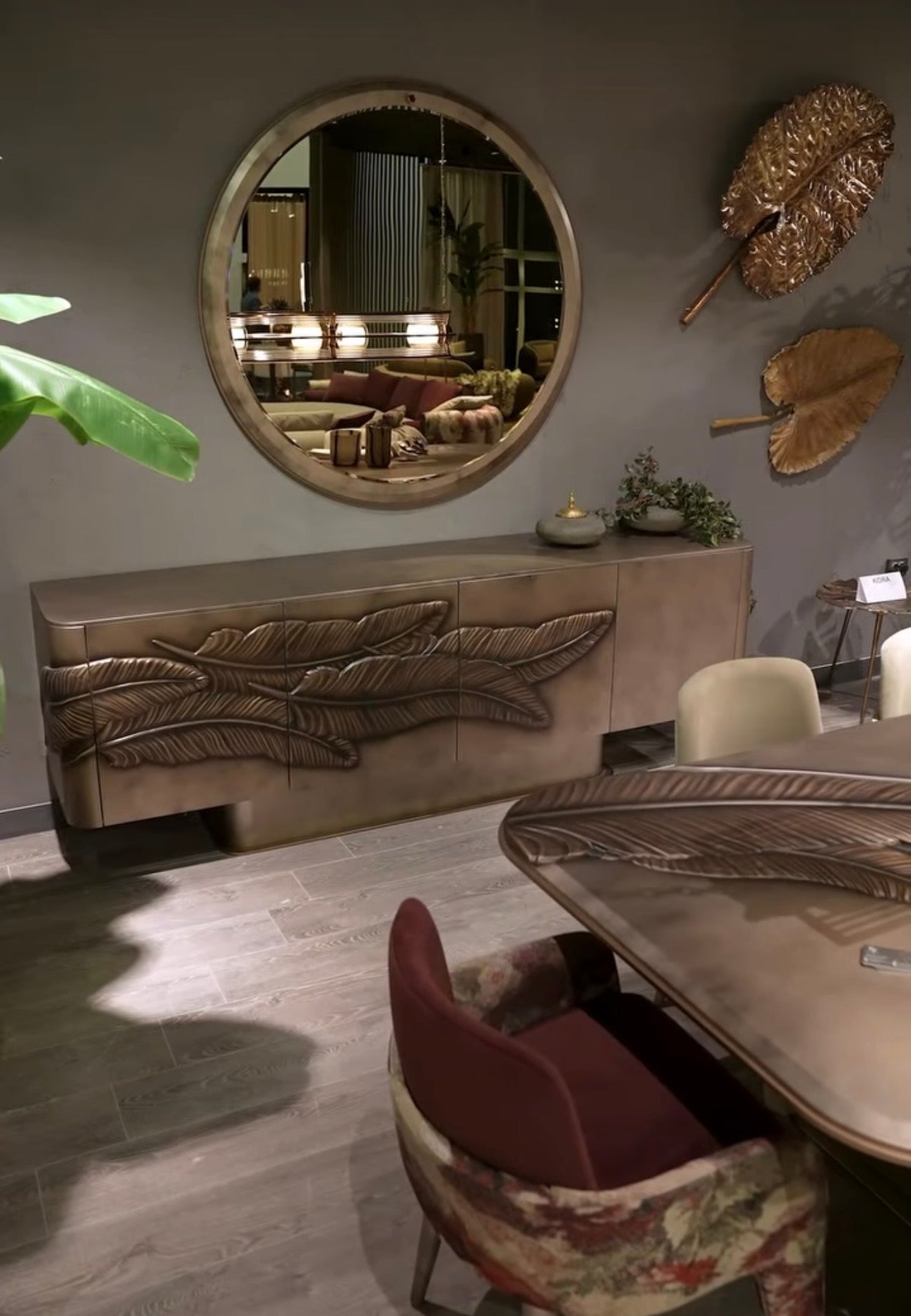 Blush luxury furniture collection featuring sculptural sofa, bronze leaf coffee table, modern dining set, and warm contemporary living room design.