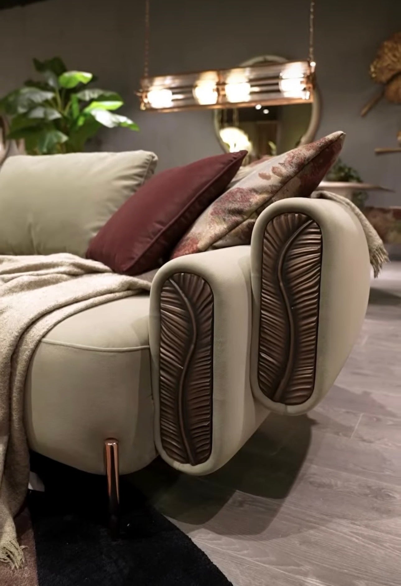 Blush luxury furniture collection featuring sculptural sofa, bronze leaf coffee table, modern dining set, and warm contemporary living room design.