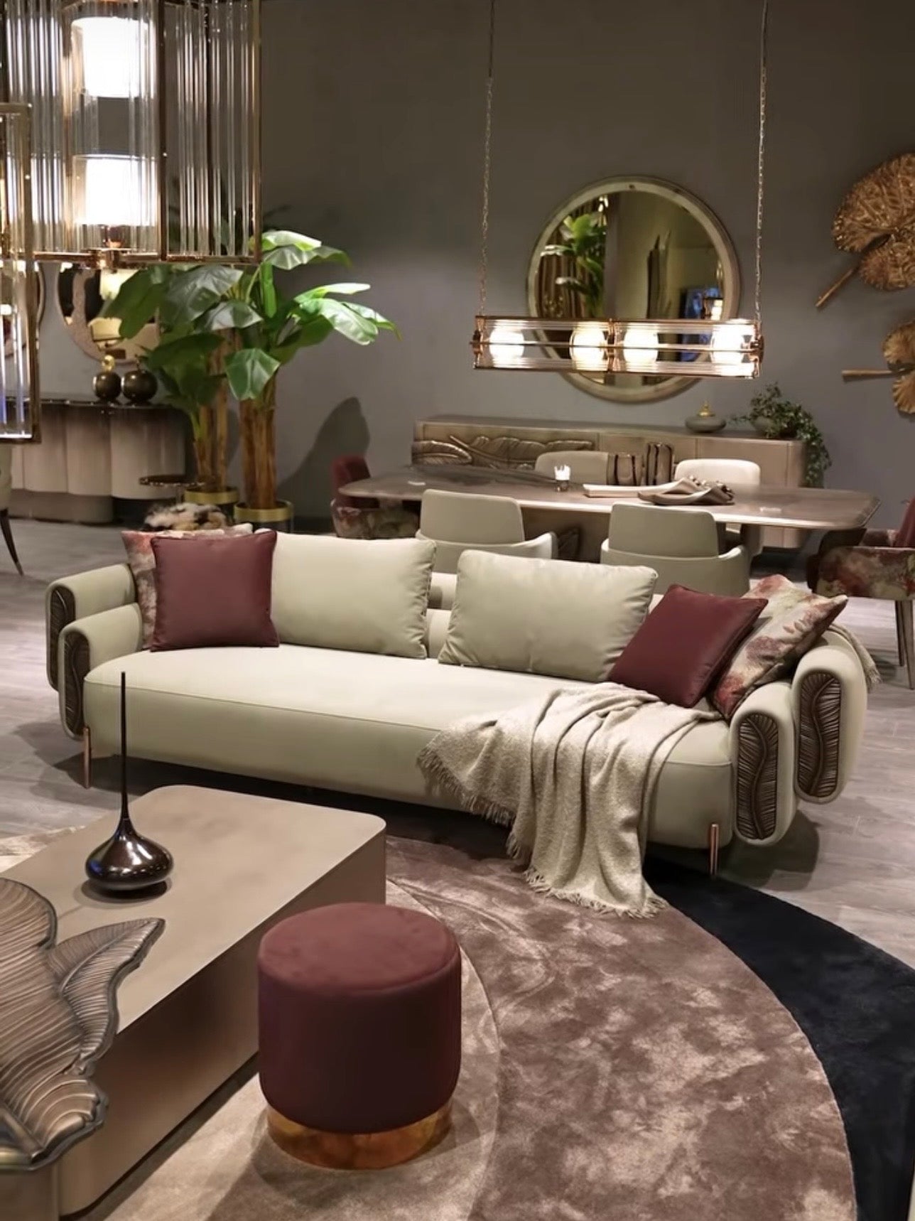 Blush luxury furniture collection featuring sculptural sofa, bronze leaf coffee table, modern dining set, and warm contemporary living room design.