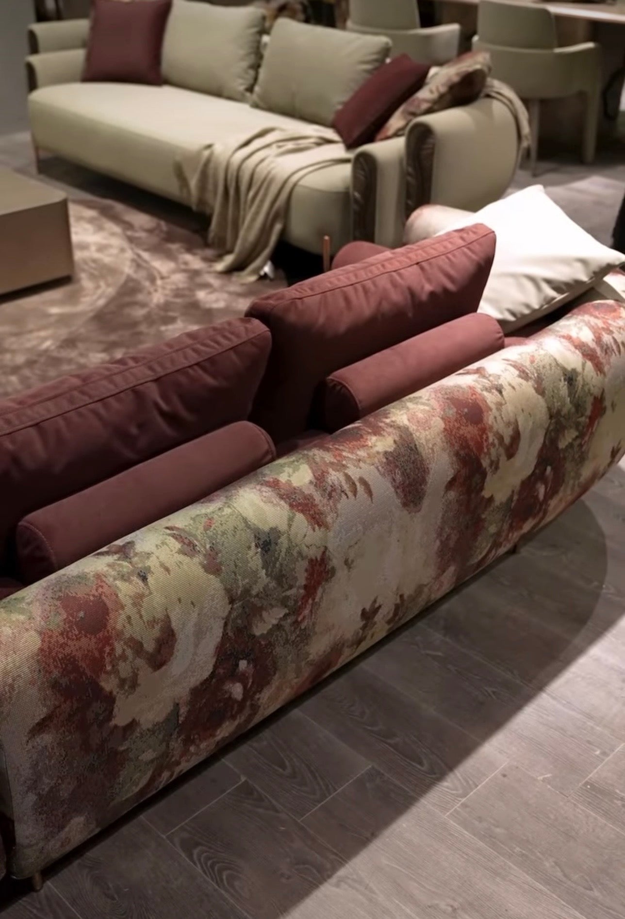 Blush luxury furniture collection featuring sculptural sofa, bronze leaf coffee table, modern dining set, and warm contemporary living room design.