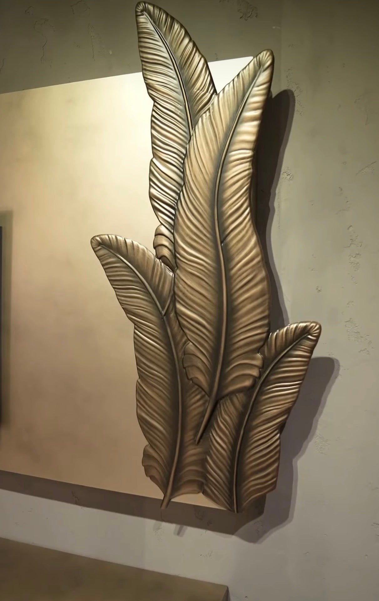 Blush luxury furniture collection featuring sculptural sofa, bronze leaf coffee table, modern dining set, and warm contemporary living room design.